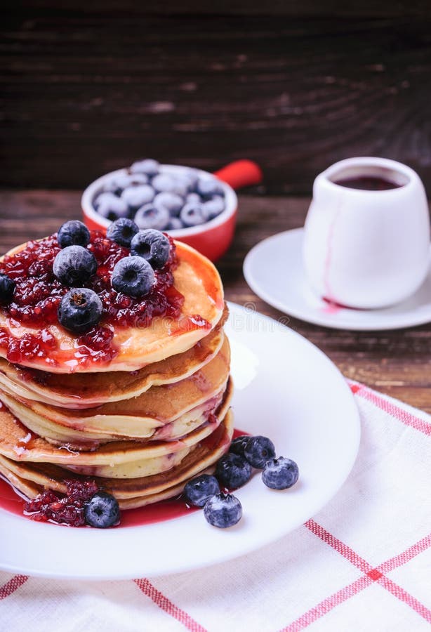 American Pancakes or Fritters Served with Strawberry and Blueberry Jam, Delicious Dessert for
