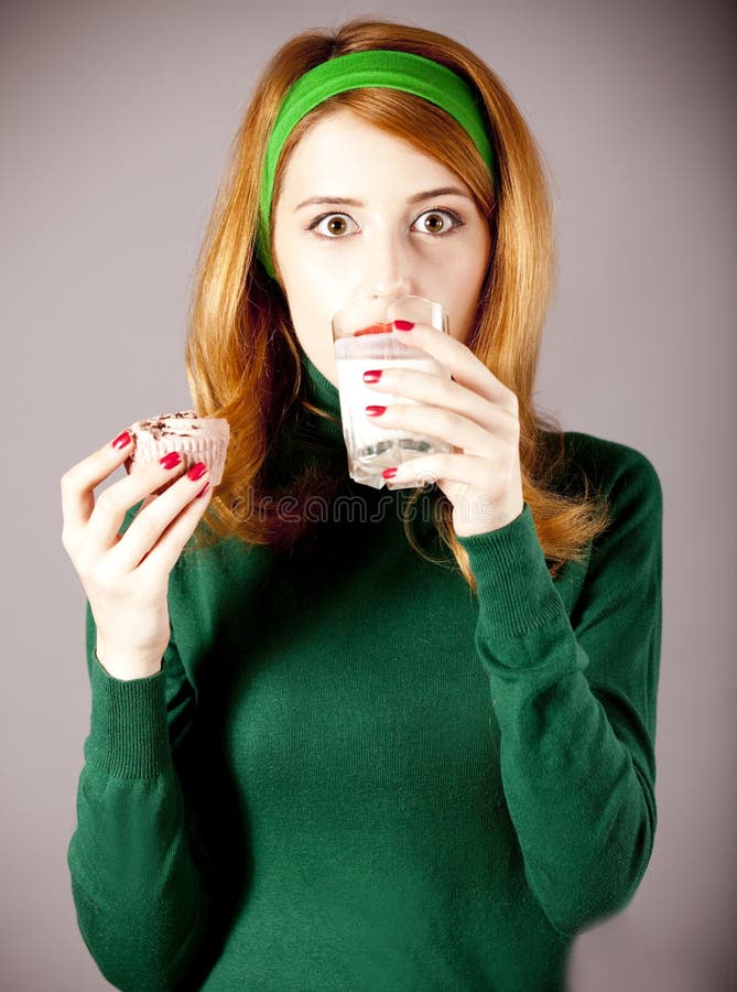 American Redhead Girl with Milk and Cake. Stock Photo Image of