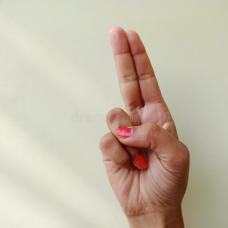 american sign language alphabet letter U displayed with isolated hand on light background stock photography american sign language alphabet letter U displayed with isolated hand on light background stock photography