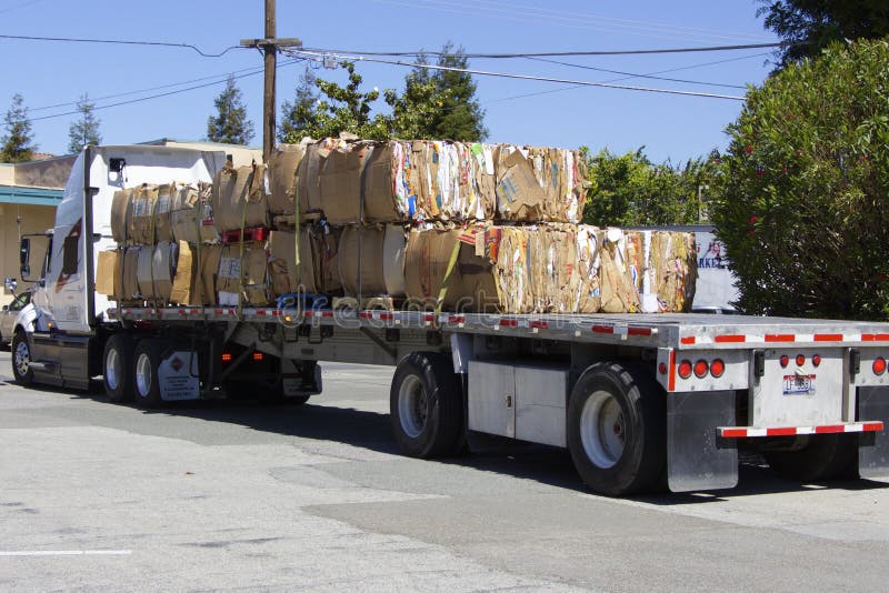 American truck with a lot of waste paper stock photo American truck with a lot of waste paper stock photo