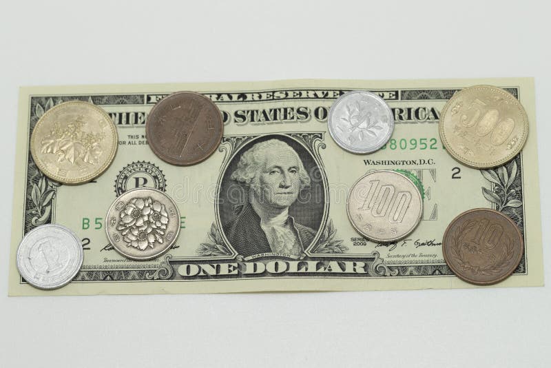 Amerikaanse dollar en JPN-Yenmuntstukken stock foto Amerikaanse dollar en JPN-Yenmuntstukken stock foto
