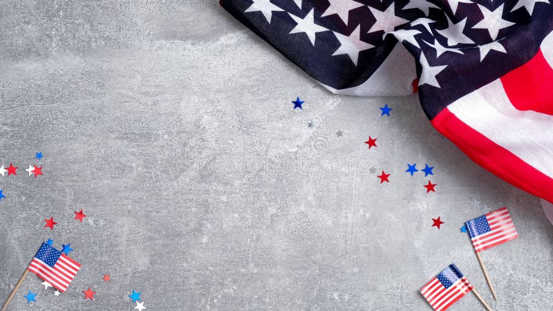 US American flags and confetti star on concrete stone background with copy space. Banner mockup for Presidents day, USA Memorial day, Veterans day, Labor day, or 4th of July celebration. US American flags and confetti star on concrete stone background with copy space. Banner mockup for Presidents day, USA Memorial day, Veterans day, Labor day, or 4th of July celebration.