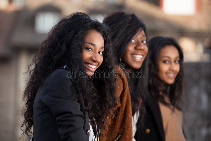 Outdoor Portrait of happy young african american teenage girls. Outdoor Portrait of happy young african american teenage girls