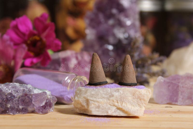 Amethyst Crystals with Flowers and Incense Cones on Meditation Table