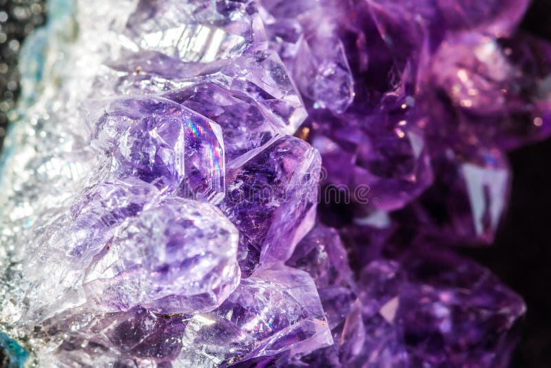 Purple and white amethyst crystals close-up. Purple and white amethyst crystals close-up