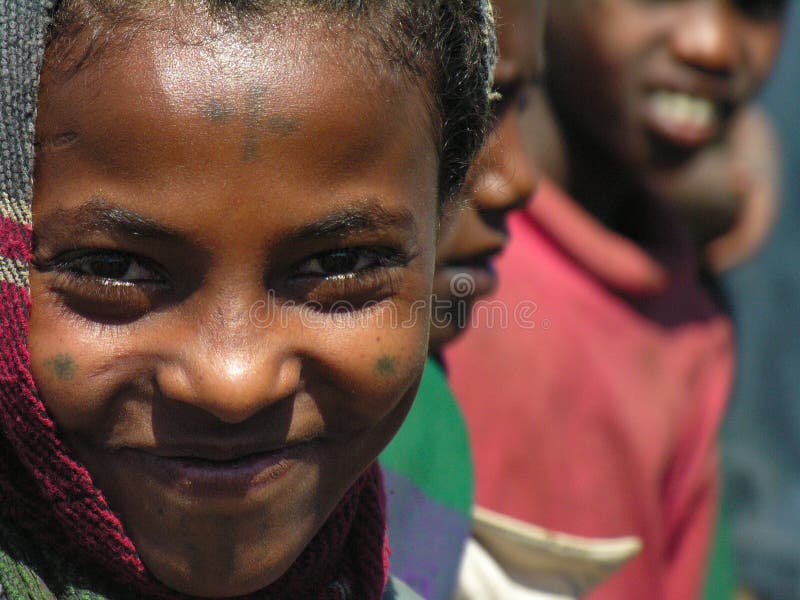 Amhara, Ethiopia, 11th December 2006: Girl from a rural community smiling for the camera. Amhara, Ethiopia, 11th December 2006: Girl from a rural community smiling for the camera