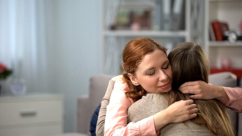 Red-haired female hugging friend, tender feelings, friendship support, love, stock photo. Red-haired female hugging friend, tender feelings, friendship support, love, stock photo