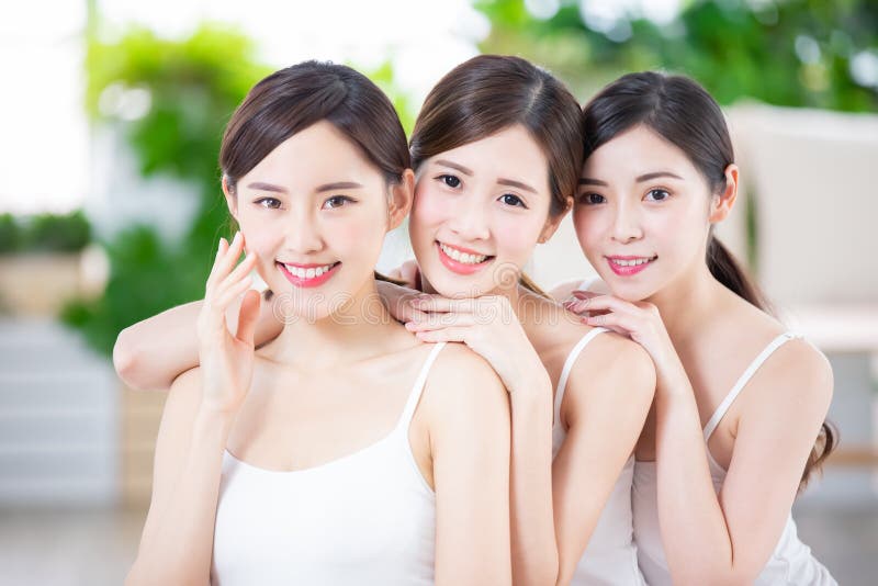 Smiling asian women friend enjoying the skin care in the spa salon. Smiling asian women friend enjoying the skin care in the spa salon