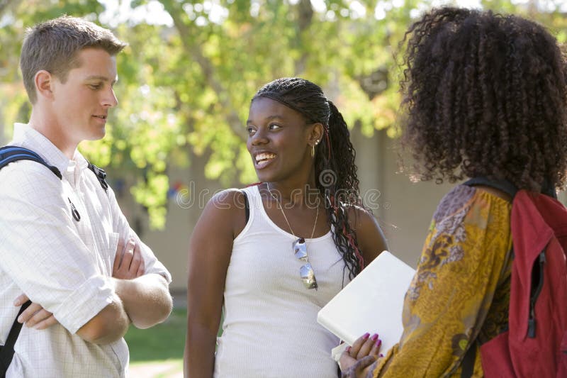 Multiethnic friends together at college campus. Multiethnic friends together at college campus