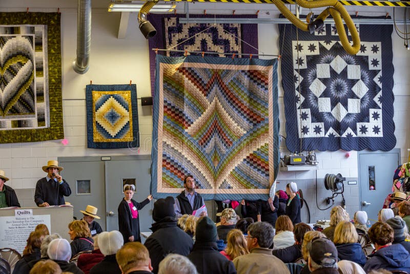 Bart, PA, USA - March 3, 2018: Quilts are just one the many items being sold at the annual Mud Sale at the Bart Fire Company. Bart, PA, USA - March 3, 2018: Quilts are just one the many items being sold at the annual Mud Sale at the Bart Fire Company.