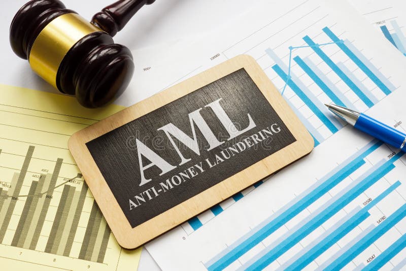 AML anti-money laundering plate and gavel with papers.