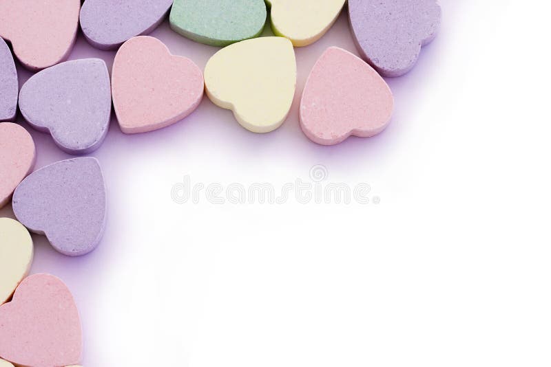 Colorful candy sweet hearts around edges of white. Colorful candy sweet hearts around edges of white