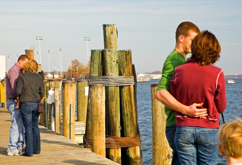 Couples in love on a waterfront dock. Couples in love on a waterfront dock.