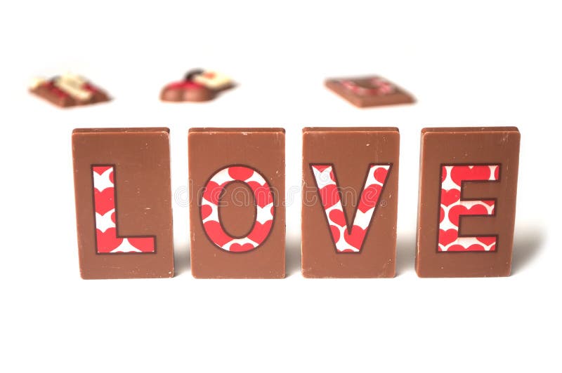 Amour de Word écrivant sur le chocolat sur le fond blanc photos stock Amour de Word écrivant sur le chocolat sur le fond blanc photos stock