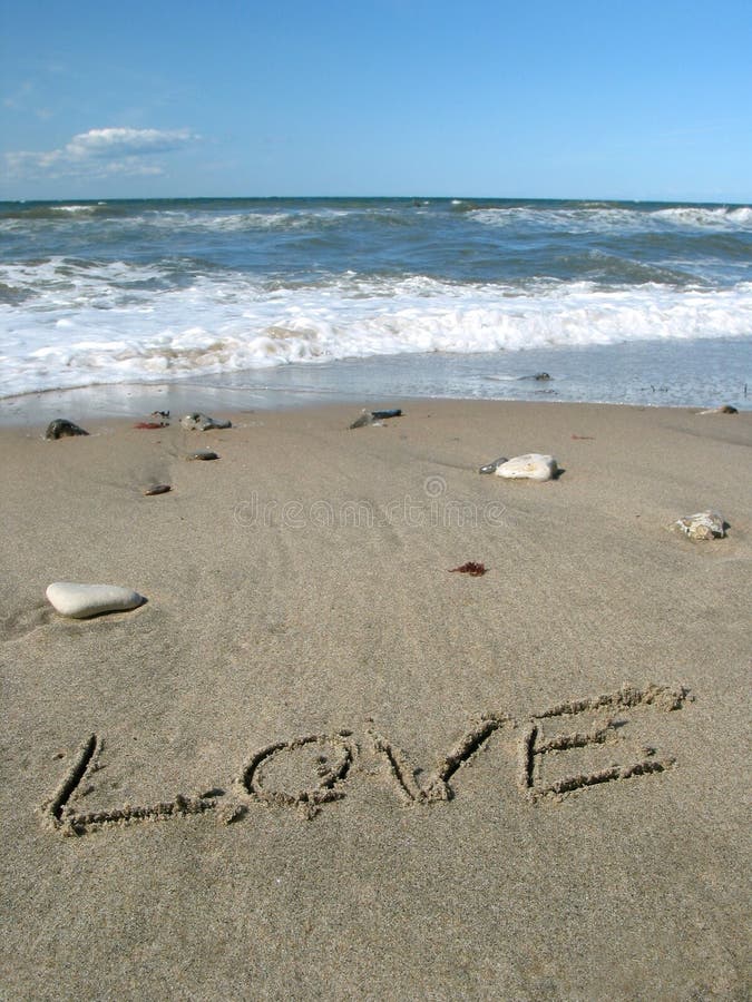 Word love written on the sand. Word love written on the sand