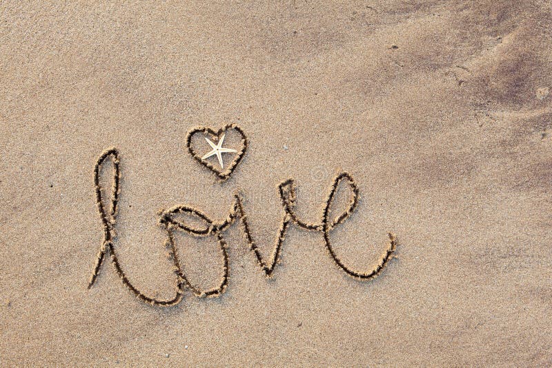 Close up of word 'love' written in sand at beach. Close up of word 'love' written in sand at beach