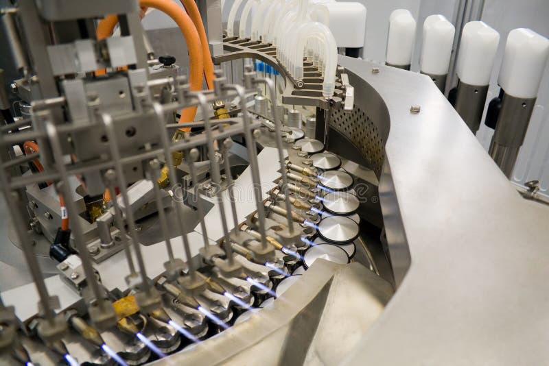 Ampoule filling and sealing machine stock photos