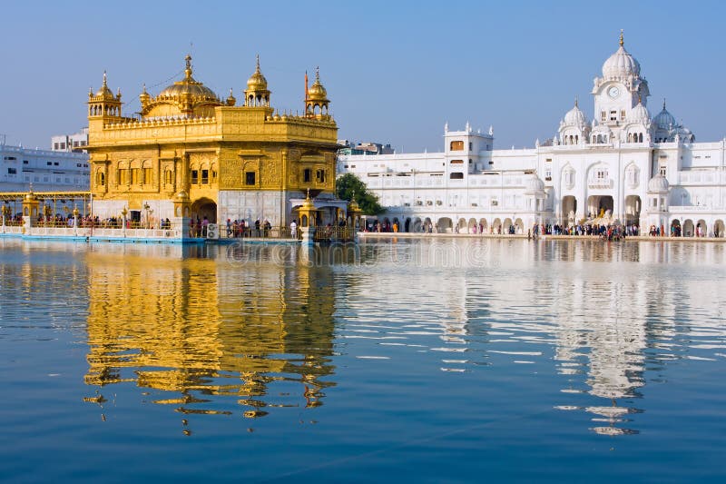 AMRITSAR, INDIA - OCTOBER 19, 2012: Sikh pilgrims in the Golden Temple during celebration day in Punjab, India. Harmandir Sahib is the holiest pilgrimage site for the Sikhs. AMRITSAR, INDIA - OCTOBER 19, 2012: Sikh pilgrims in the Golden Temple during celebration day in Punjab, India. Harmandir Sahib is the holiest pilgrimage site for the Sikhs.