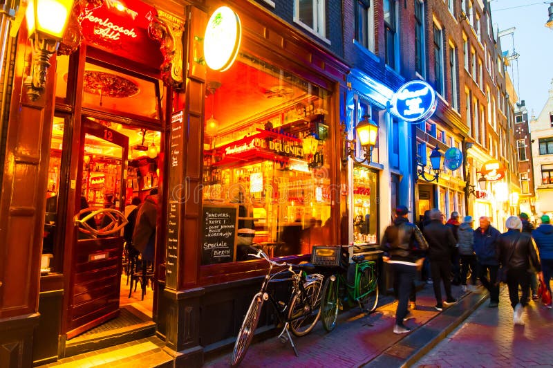 AMSTERDAM-APRIL 27: Nightlife on Amsterdam narrow street around red light district on April 27,2015, the Netherlands.