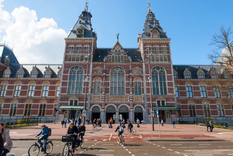 AMSTERDAM-APRIL 30: The Rijksmuseum, crowd of people ride bicycles on April 30, 2015.