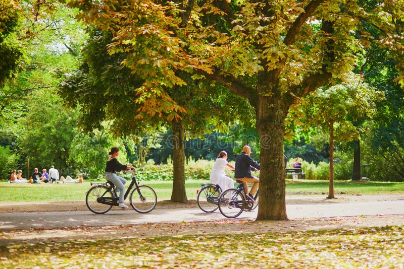 AMSTERDAM, the NETHERLANDS AUGUST 18, 2022 People Riding Bikes in