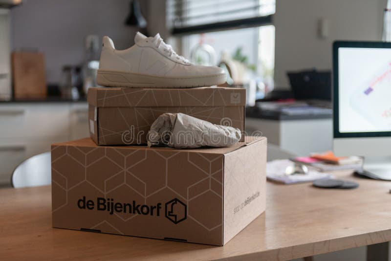 De Bijenkorf Online Package Delivery, Unboxing Package, Online Shopping, Fashion Shoes, White Box on the Table Editorial Stock Photo - Image desk, sale:
