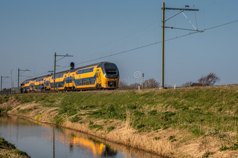 Amsterdam, Netherlands, march 2022. Dutch train in the landscape and in the central station