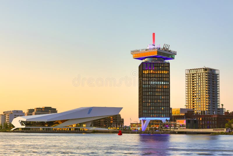 Amsterdam, Netherlands - May, 2018: EYE Film Institute Netherlands and DAM Toren tower during amazing sunset in the evening in Ams royalty free stock images Amsterdam, Netherlands - May, 2018: EYE Film Institute Netherlands and DAM Toren tower during amazing sunset in the evening in Ams royalty free stock images