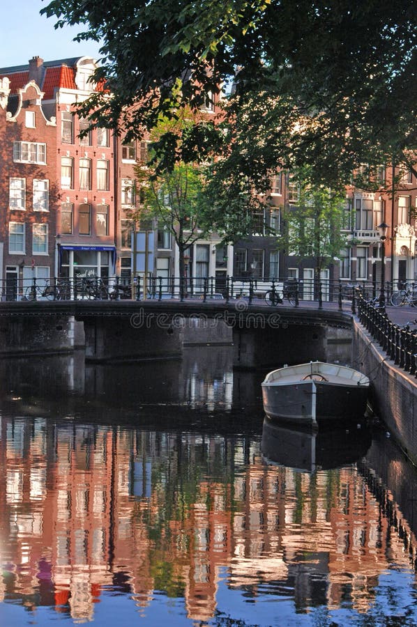 Row homes and reflections in canal. Row homes and reflections in canal.