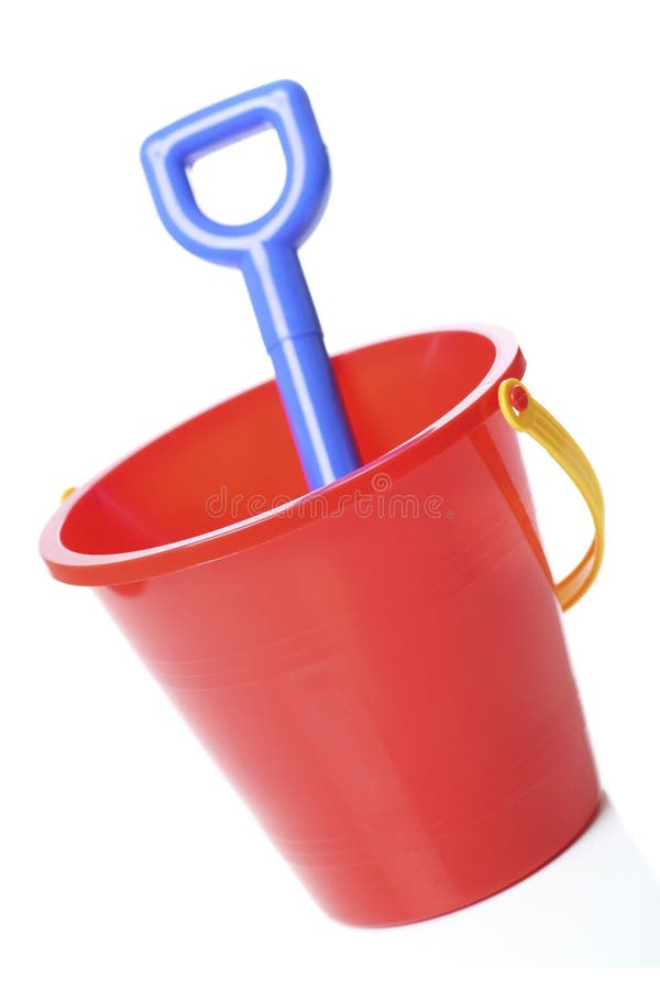 Red bucket with spade, ready for that summer holiday. Red bucket with spade, ready for that summer holiday