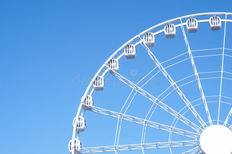 Amusement park. People having fun. Ferries wheel ride. Minimalism royalty free stock image Amusement park. People having fun. Ferries wheel ride. Minimalism royalty free stock image