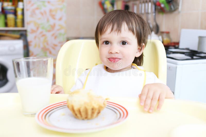 Amusing Baby Eating Cupcake And Milk Stock Photo Image of caucasian