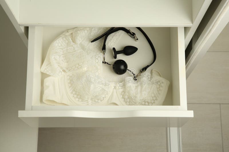 Anal Plug, Ball Gag and Women S Underwear in Open Drawer of Nightstand  Indoors, Closeup. Sex Toys Stock Photo - Image of erotic, play: 291684684