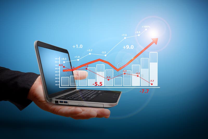 Analyzing financial charts by laptop. Analyzing financial charts by laptop