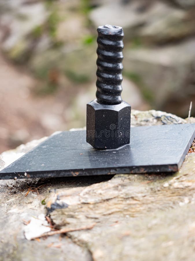 Anchor Bolt in the Granite Stone, Protecting the Bridge Stock Image