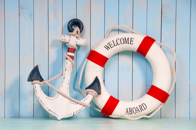 Anchor and life buoy on a background of shabby wall boards