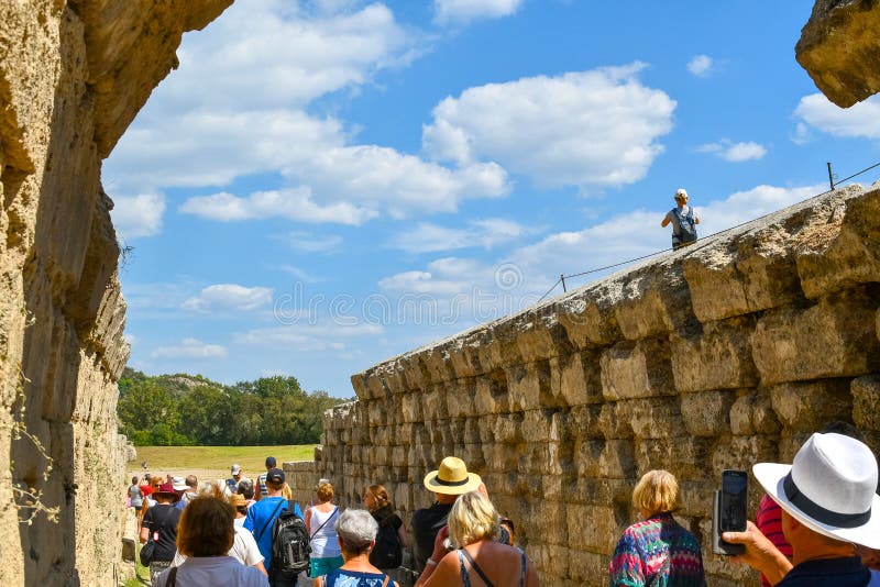 The Ancient Arena Stadium in the Town of Olympia, Greece As Tourists ...