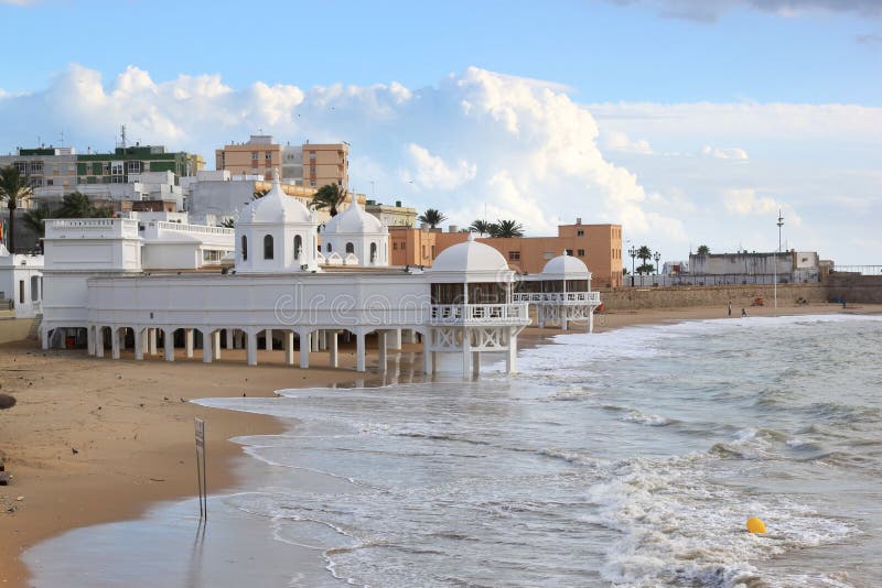 Ancient baths at the beach of Cadiz, Spain. The ancient baths of Nuestra Senora de la Palma at Playa de La Caleta from 1926. Cadiz is a city and port in stock photography Ancient baths at the beach of Cadiz, Spain. The ancient baths of Nuestra Senora de la Palma at Playa de La Caleta from 1926. Cadiz is a city and port in stock photography