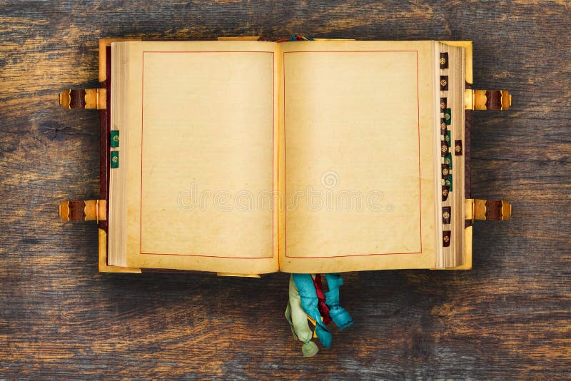 Ancient book on a wooden background stock photography