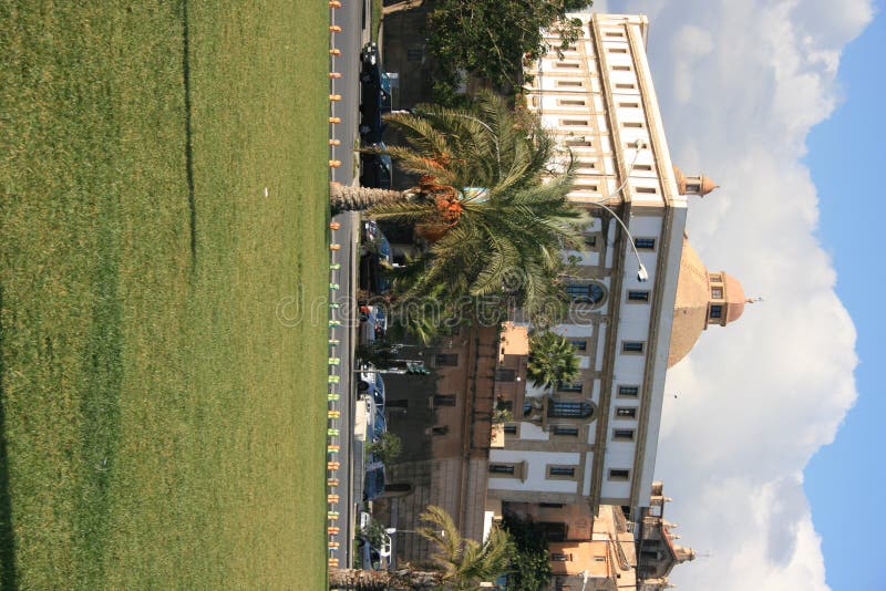 Ancient building & Palms Foro Italico. Palermo royalty free stock image