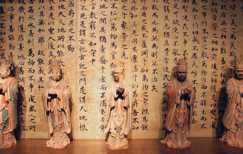 Ancient calligraphy and statue royalty free stock photography