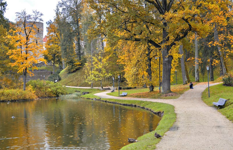 Ancient castle and autumnal park