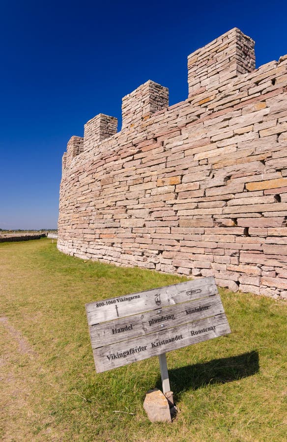 Ancient castle wall with information sign