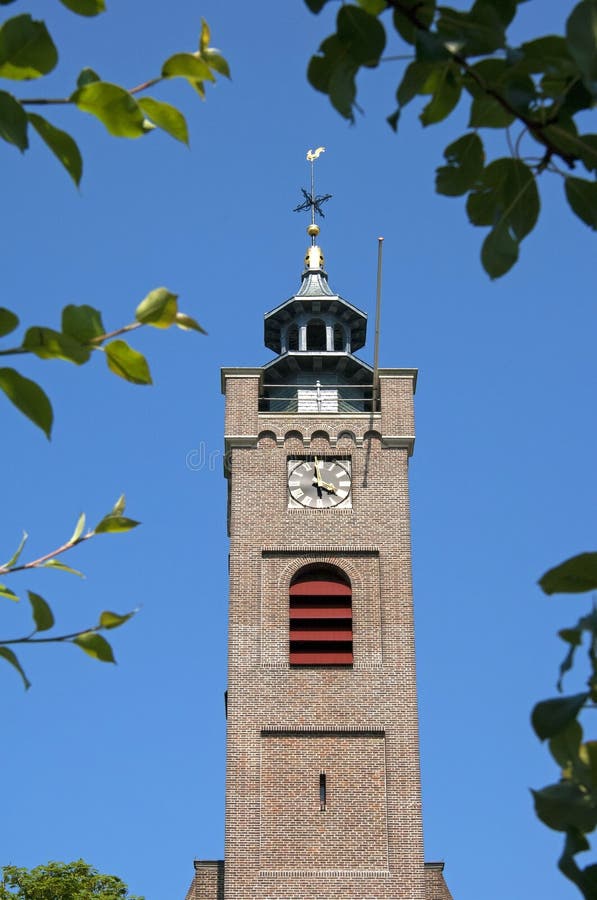 Ancient church tower seen through tree branches