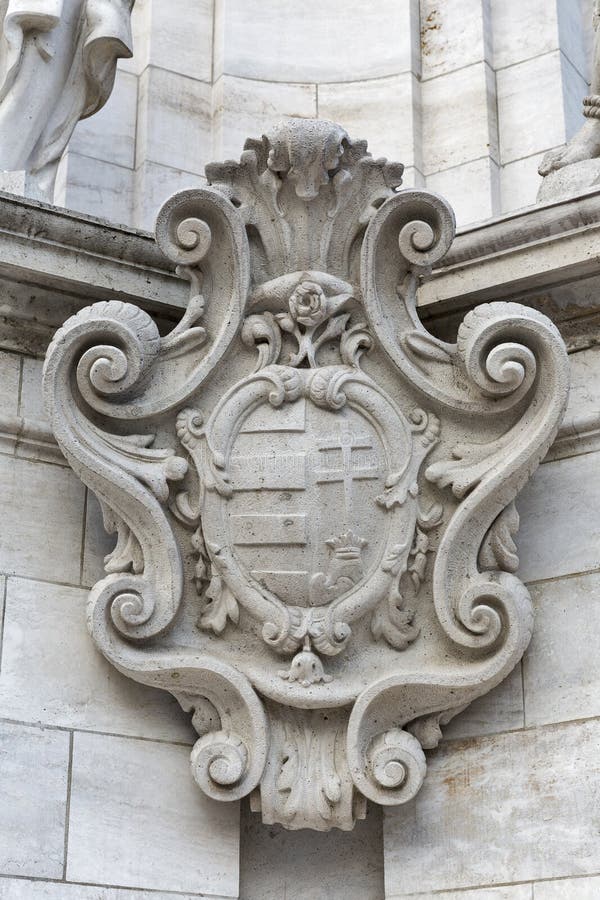 Ancient Coat of Arms on Holy Trinity Column on Trinity Square in front of Matyas Church, Buda Castle area, Budapest, Hungary. Ancient Coat of Arms on Holy Trinity Column on Trinity Square in front of Matyas Church, Buda Castle area, Budapest, Hungary