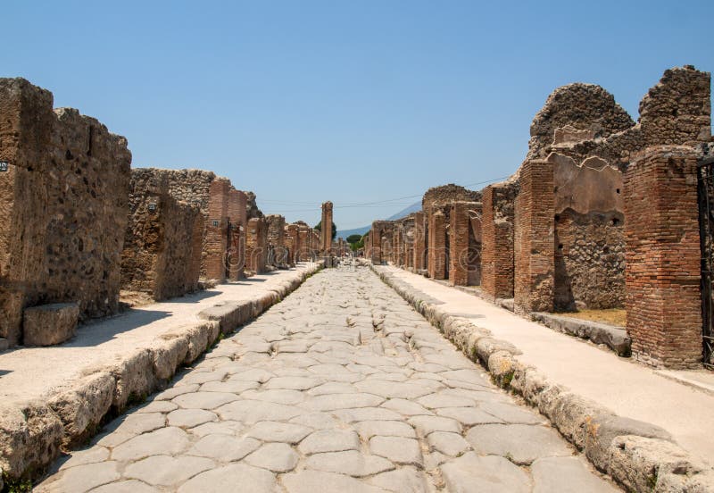 An Ancient Cobbled Street in the Ruins of Pompeii, Italy. Stock Photo ...