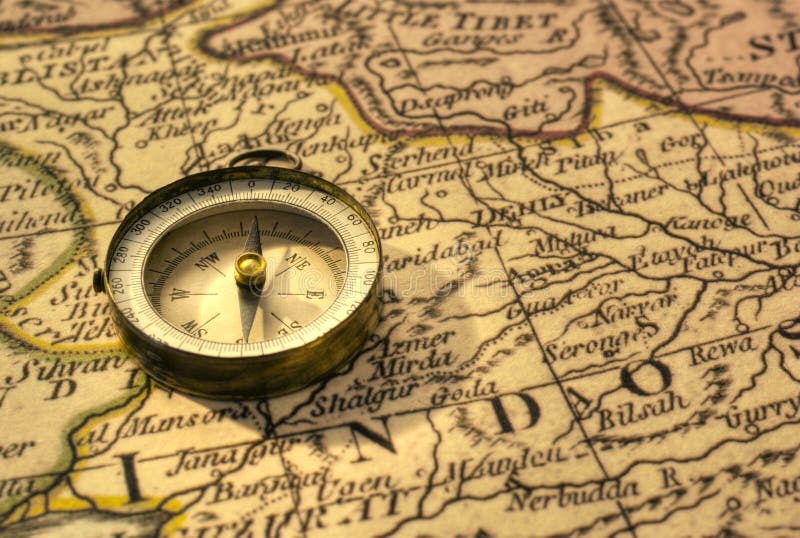 Compass and Chess on old map Stock Photo by ©kwanchaidp 75914687