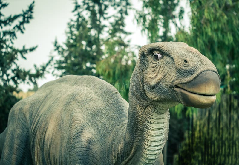 Ancient extinct dinosaur on a background of plants