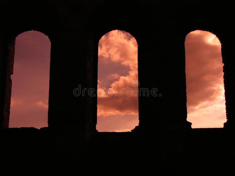 Ancient gothic windows at sunset