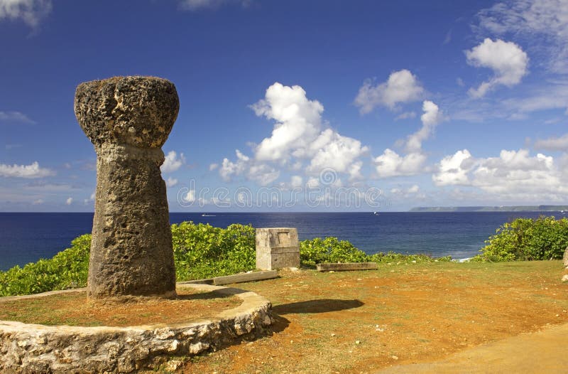 Ancient Latte stones behind the governor's mansion in Guam with the ocean in the background. Ancient Latte stones behind the governor's mansion in Guam with the ocean in the background